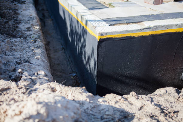 Professional Basement Waterproofing technician working in Louisville, KY
